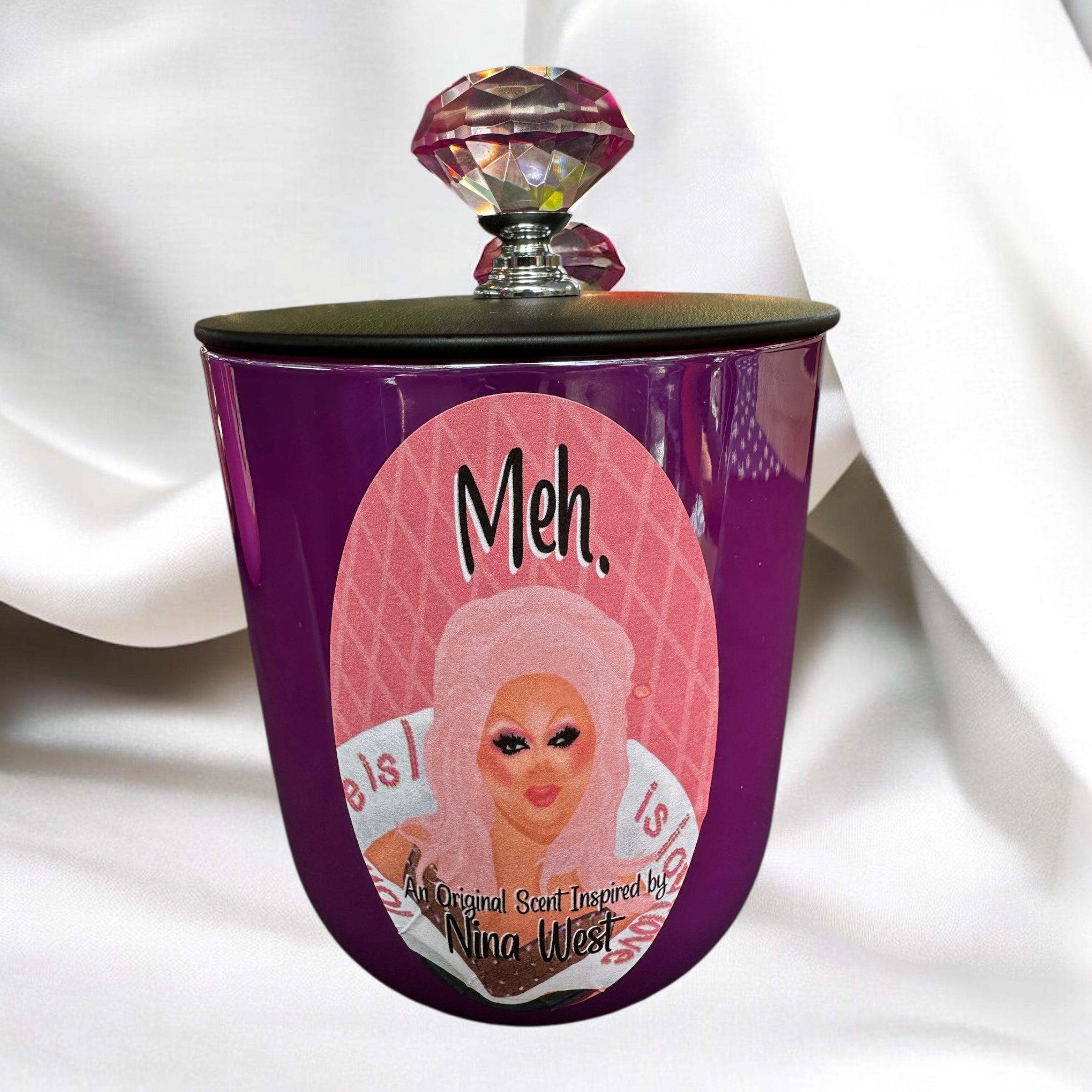 Purple candle jar with a label featuring Nina West and text on a white background
