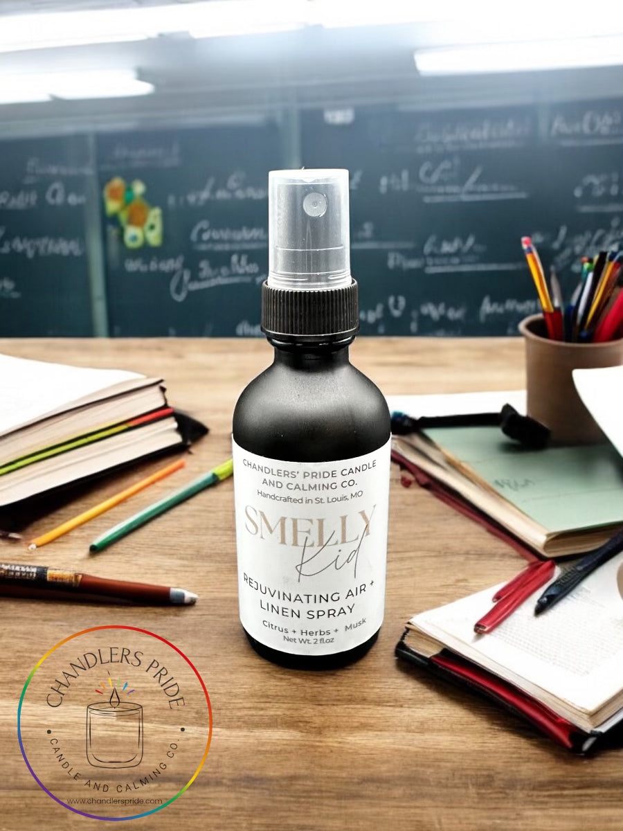 AireCare room spray botttle on wood desk with papers and pens