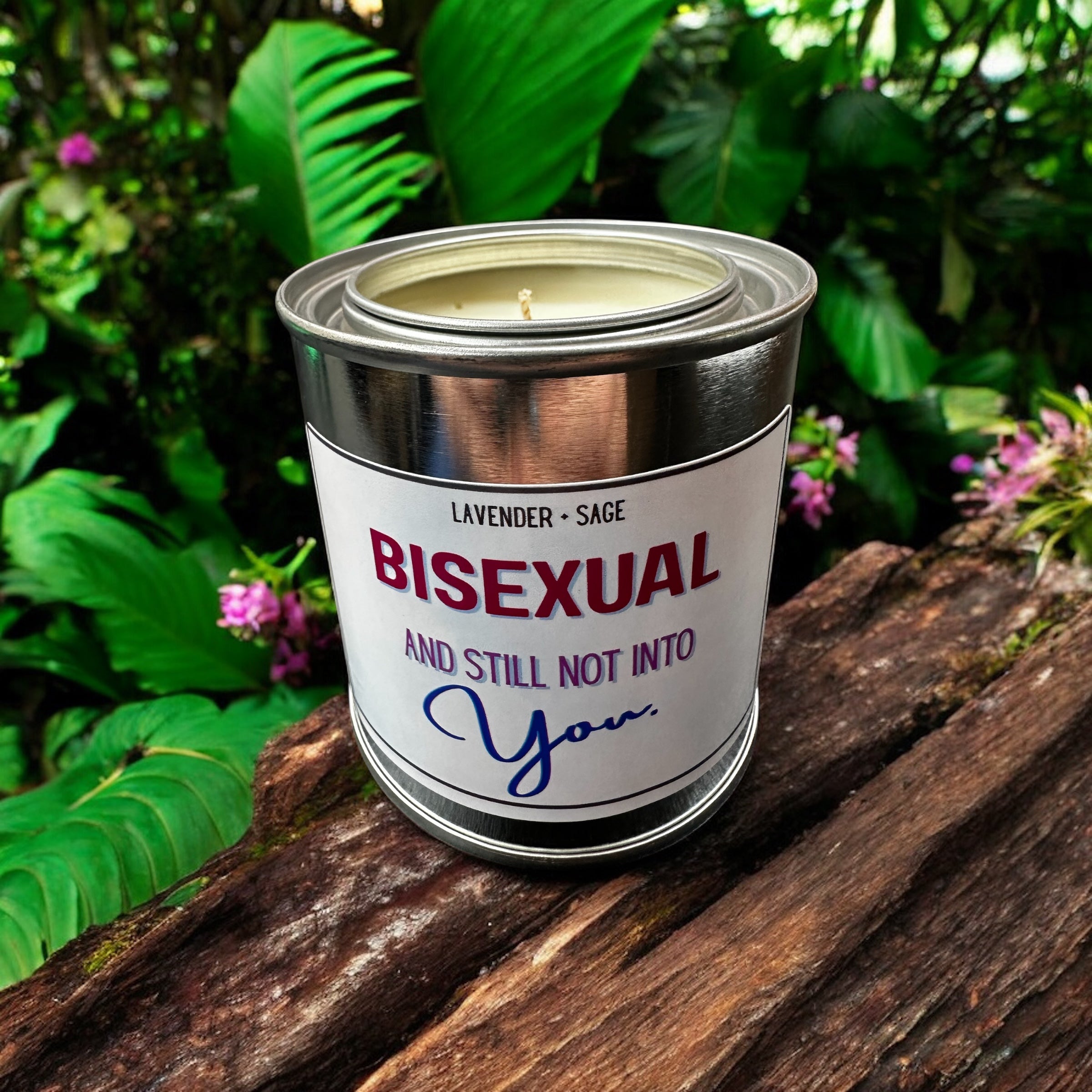 Candle in a can labeled 'Bisexual and Still Not Into You' on a wooden surface with a natural background.